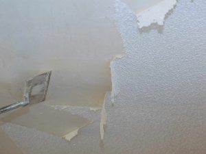 Removal old dirty popcorn ceiling wall background